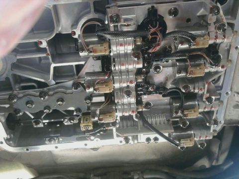 1995 Ford Bronco - Automatic transmission valve body detail, showing solenoids and electrical connectors.