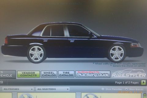2000 Mercury Grand Marquis - A dark blue sedan is shown from the side with custom wheels on a digital display.