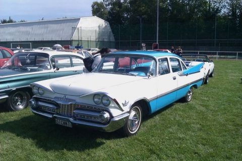 1991 Ford Crown Victoria - A two-tone 1959 Dodge Coronet sedan displayed at an outdoor car show.