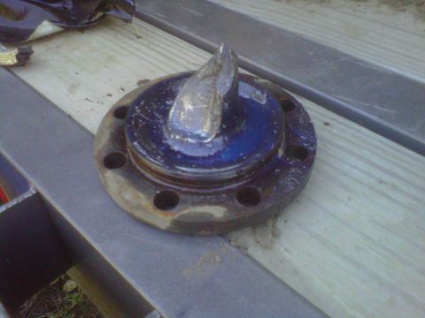 1992 Ford F-350 - This appears to be a damaged trailer hub, not a 1992 Ford F-350 part.