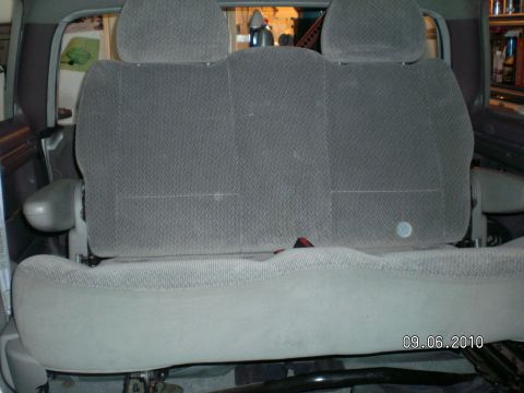 1996 Ford Bronco - Interior view of a vehicle's rear seat, showing fabric upholstery and headrests.