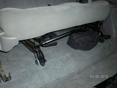 1996 Ford Bronco - Car seat mechanism detail, showing the metal frame and adjustment levers.