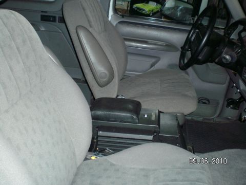 1996 Ford Bronco - Interior view of a 1996 Ford Bronco, showing the front seats and center console.