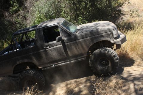1992 Ford Bronco - This 1992 Ford Bronco is shown navigating a dusty, off-road trail.