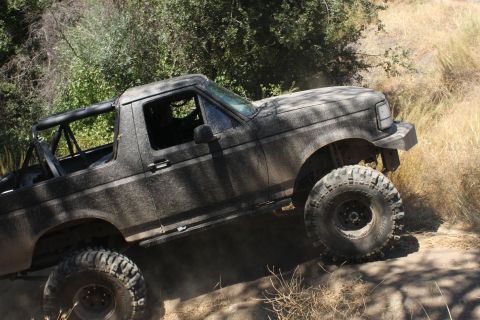 1992 Ford Bronco - This 1992 Ford Bronco is navigating a steep, dusty trail.