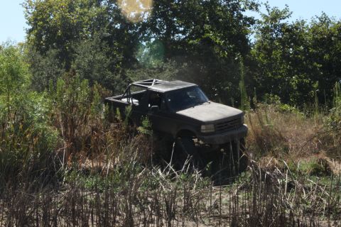 1992 Ford Bronco - This 1992 Ford Bronco is navigating a rough, overgrown trail.
