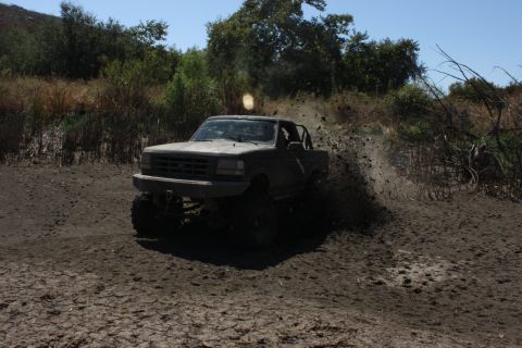 1992 Ford Bronco - This 1992 Ford Bronco is captured mid-action as it navigates a muddy trail.