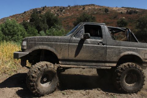 1992 Ford Bronco - This lifted 1992 Ford Bronco is covered in mud after an off-road adventure.