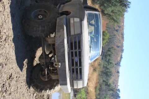 1992 Ford Bronco - This 1992 Ford Bronco is shown in a muddy, off-road environment.