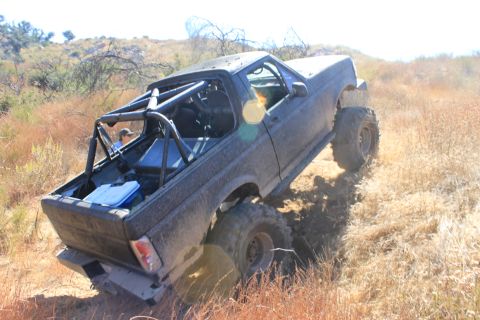 1992 Ford Bronco - This 1992 Ford Bronco is equipped with a roll cage and large tires for off-road use.