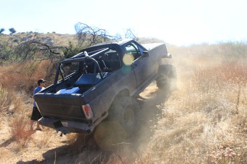 1992 Ford Bronco - Modified 1992 Ford Bronco tackling an off-road trail.