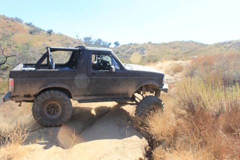 1992 Ford Bronco - This 1992 Ford Bronco is navigating a challenging off-road trail.
