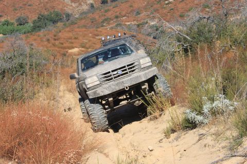 1992 Ford Bronco - This 1992 Ford Bronco is navigating a challenging off-road trail.