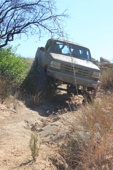 1992 Ford Bronco - This 1992 Ford Bronco is navigating a challenging off-road trail.