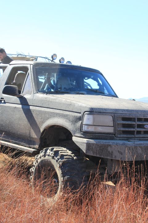 1992 Ford Bronco - This 1992 Ford Bronco is ready for off-road adventure, covered in mud and sporting large tires.