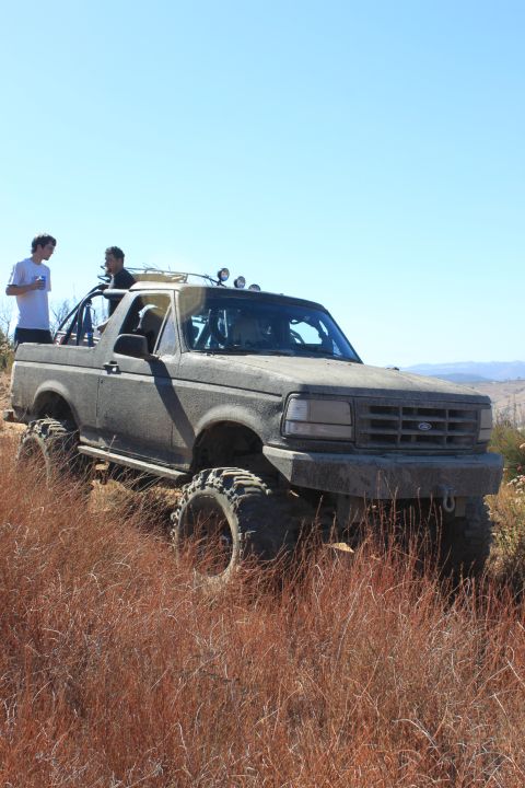 1992 Ford Bronco - This lifted 1992 Ford Bronco is equipped for off-road adventures, with large tires and auxiliary lights visible.