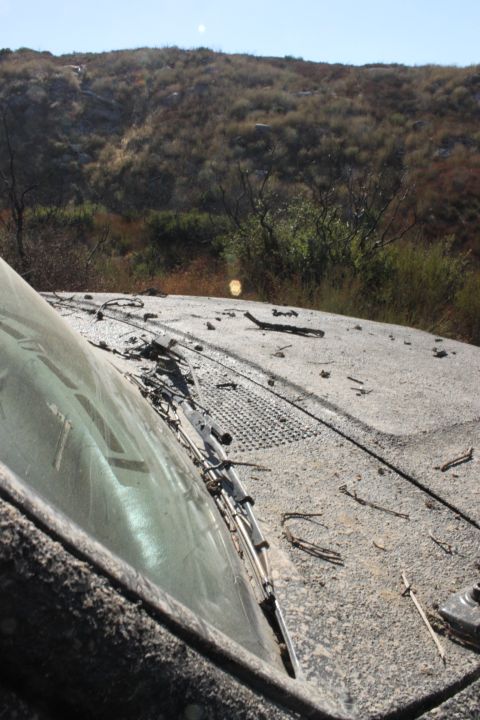 1992 Ford Bronco - A vehicle sits in a dry, brush-covered landscape under a clear sky.