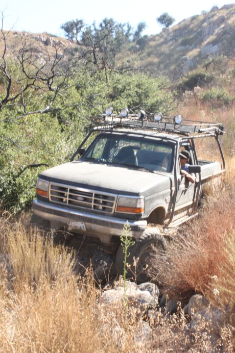 1992 Ford Bronco - This 1992 Ford F-150 pickup truck is shown off-roading on a dry, grassy hillside.