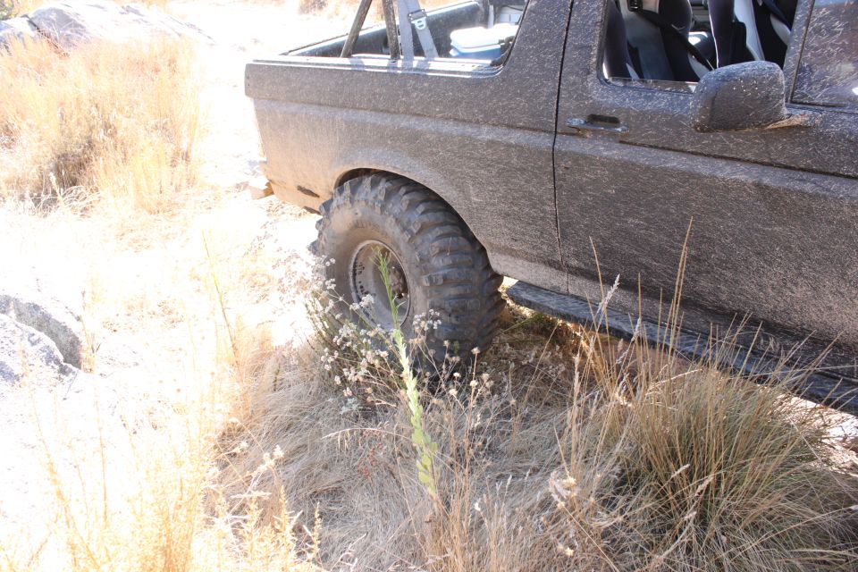 1992 Ford Bronco side view, dirty, off-road tires