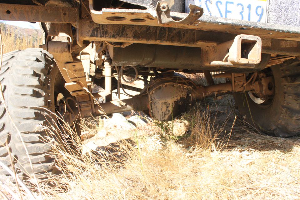 Rear axle and leaf springs of a truck with a license plate reading 'SSE 319'