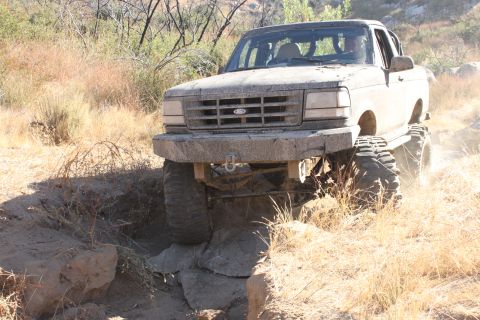 1992 Ford Bronco - This 1992 Ford Bronco navigates a challenging rocky trail, its off-road capabilities.