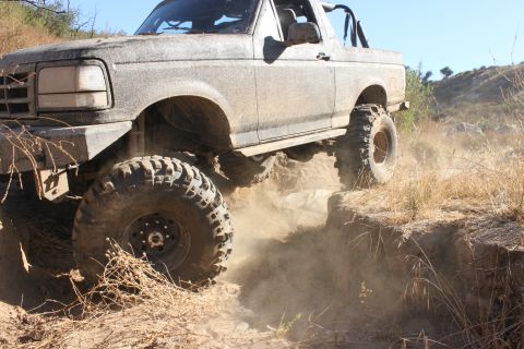 1992 Ford Bronco - This 1992 Ford Bronco is navigating a challenging off-road trail.