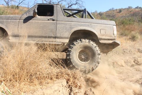 1992 Ford Bronco - This 1992 Ford Bronco is navigating a challenging off-road trail.