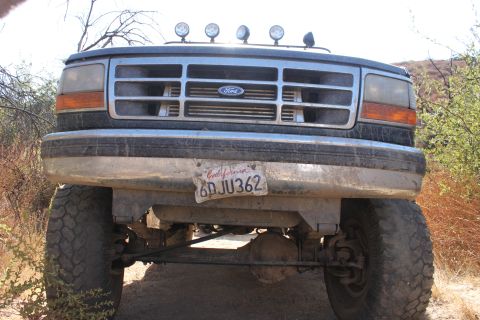 1992 Ford Bronco - Front view of a 1992 Ford Bronco with a California license plate, parked outdoors.