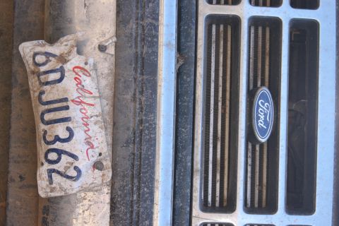 1992 Ford Bronco - Close-up of a 1992 Ford Bronco grille and a California license plate.