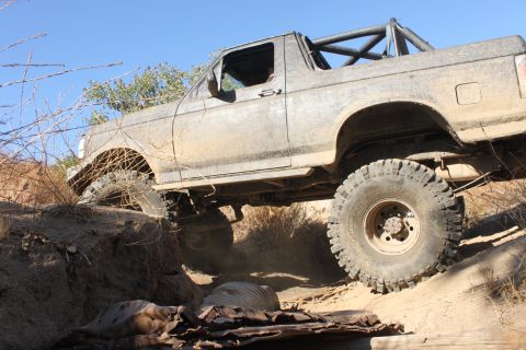 1992 Ford Bronco - This 1992 Ford Bronco is navigating a challenging off-road obstacle.