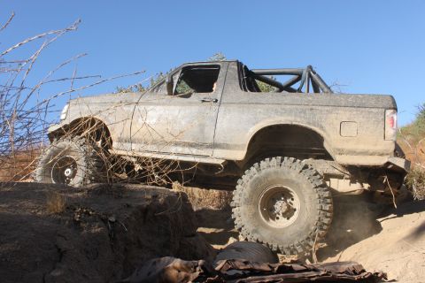 1992 Ford Bronco - This 1992 Ford Bronco is navigating a challenging off-road trail.