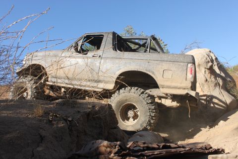 1992 Ford Bronco - A heavily modified 1992 Ford Bronco navigates a challenging off-road course.