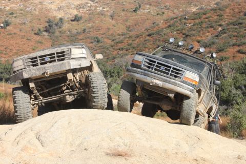 1992 Ford Bronco - Two 1992 Ford Broncos navigate a challenging off-road trail.