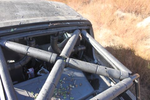 1992 Ford Bronco - Vehicle interior with a complex roll cage, suggesting off-road modification.
