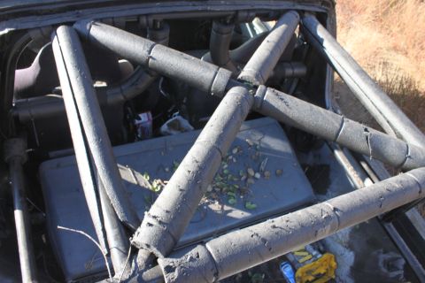 1992 Ford Bronco - The interior of a vehicle is visible, focusing on a padded roll cage structure.