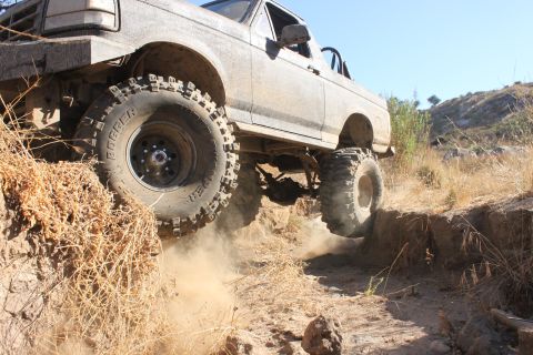 1992 Ford Bronco - This 1992 Ford Bronco is tackling a challenging off-road obstacle.