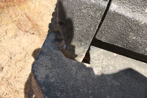 1992 Ford Bronco - A close-up view of a damaged vehicle bumper fragment.