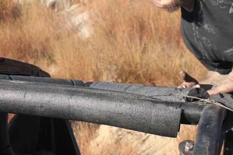 Roll bar padding on a vehicle with Supermotors.net logo