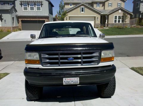 1995 Ford Bronco - Front view of a 1995 Ford Bronco parked in a driveway.