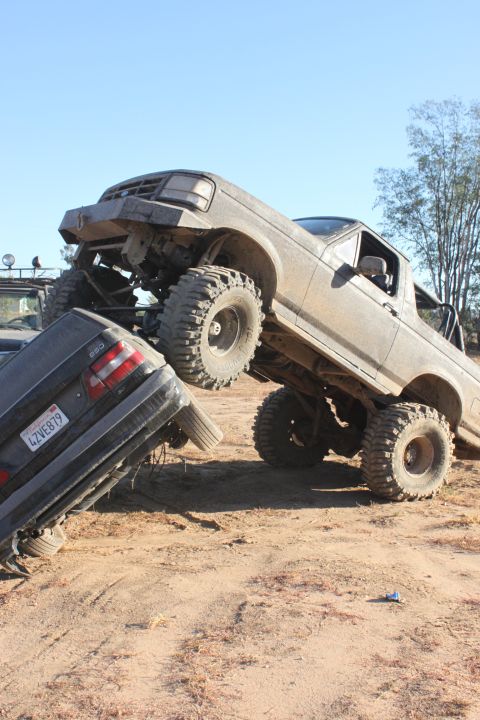 1992 Ford Bronco crushing a sedan, 3q-front view