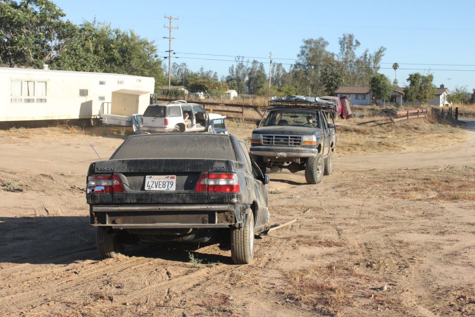 1992 Ford Bronco with roof rack, front 3/4 view, dusty