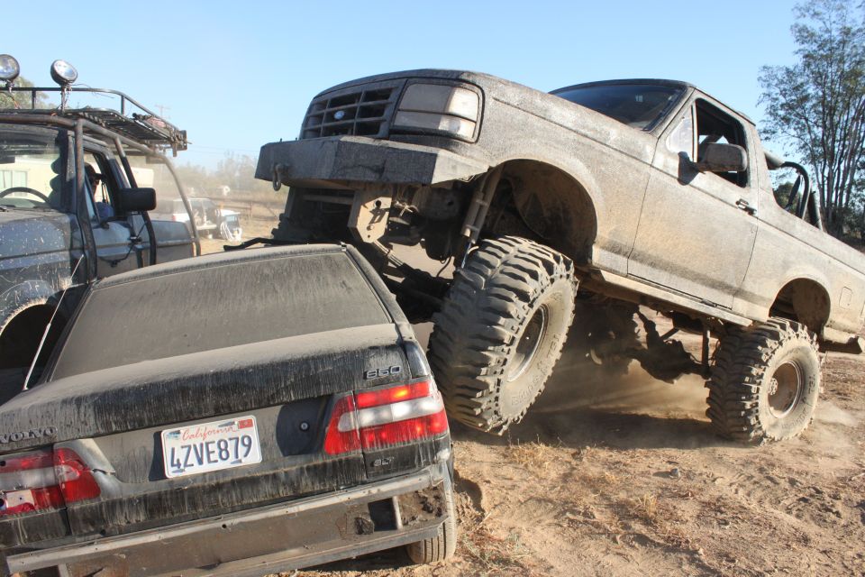 1992 Ford Bronco crushing a Volvo sedan, front grille visible