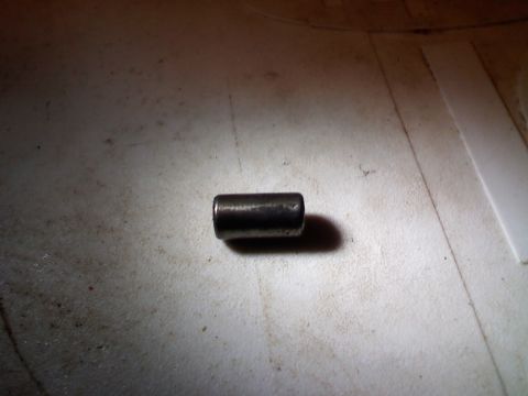 1990 Ford Bronco - A single metal pin is shown against a textured background.