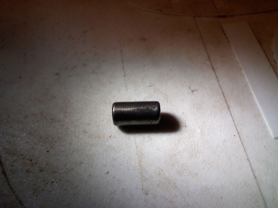 Metal pin on textured surface