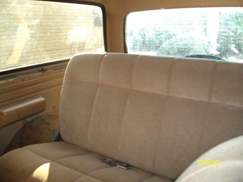 1990 Ford Bronco - Interior view of a vehicle's rear bench seat and windows, with a watermark indicating it was uploaded in 2012.