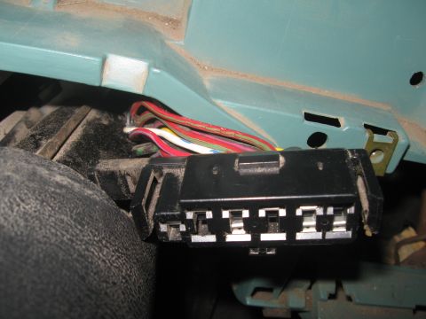 1981 Ford Bronco - A close-up view of a vehicle's wiring harness connector, showing multiple colorful wires.