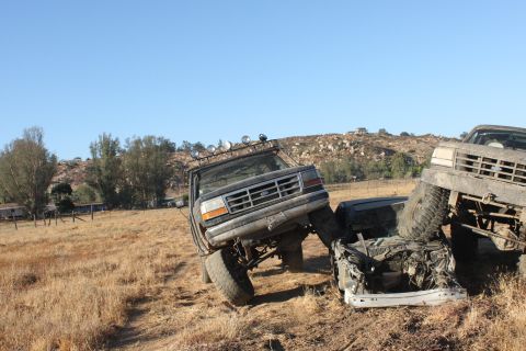 1992 Ford Bronco on top of another vehicle, front view