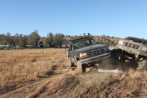 1992 Ford Bronco and another truck off-roading
