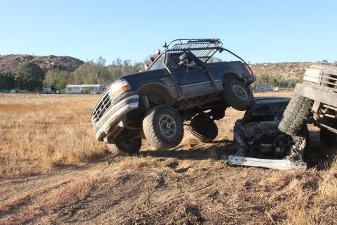 1992 Ford Bronco front grille and lifted body on crushed car