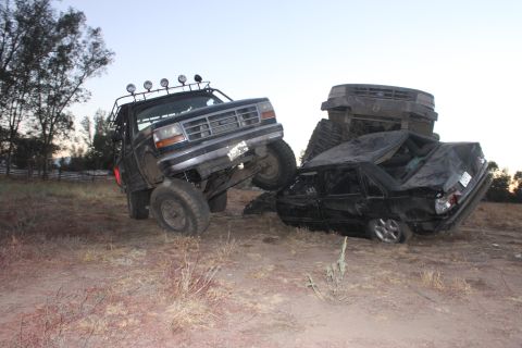 1992 Ford Bronco front grille, lifted, on crushed car